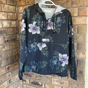 Women’s floral raincoat pull over. Size small.